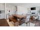 Open-concept living space with a dining table and a comfortable sofa at 416 Clemson Tree Ln, Lake Wylie, SC 29710
