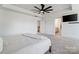 Spacious main bedroom with neutral carpet, a ceiling fan, and access to the ensuite bathroom at 416 Clemson Tree Ln, Lake Wylie, SC 29710