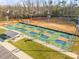 Aerial view of well-maintained pickleball courts with blue and orange surfaces at 416 Clemson Tree Ln, Lake Wylie, SC 29710