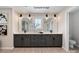 Modern bathroom featuring a double vanity, quartz countertop, and dual mirrors with decorative sconces at 4688 Glen Stripe Dr # Cal0069, Indian Trail, NC 28079