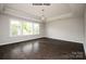 Bright, spacious bedroom features a trey ceiling, large windows, and beautiful hardwood floors at 4688 Glen Stripe Dr # Cal0069, Indian Trail, NC 28079