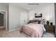 Comfortable bedroom featuring a queen-sized bed, bedside tables, and light-colored carpet at 4688 Glen Stripe Dr # Cal0069, Indian Trail, NC 28079