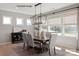 Bright dining room featuring an elegant chandelier, large windows, and stylish decor at 4688 Glen Stripe Dr # Cal0069, Indian Trail, NC 28079