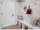 Mud room with custom wall mounted coat rack, built-in bench, and stylish decorations at 4688 Glen Stripe Dr # Cal0069, Indian Trail, NC 28079