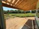 Covered patio space showcasing wood framing and a scenic view of the green yard at 4688 Glen Stripe Dr # Cal0069, Indian Trail, NC 28079