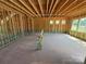An empty basement with framing and windows provides a blank slate ready to be renovated at 4688 Glen Stripe Dr # Cal0069, Indian Trail, NC 28079