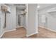 Spacious walk-in closet featuring ample shelving, storage space, and hardwood flooring at 4688 Glen Stripe Dr # Cal0069, Indian Trail, NC 28079