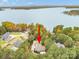 Stunning lakefront home featuring lush trees and private boat dock, offering scenic waterfront living at 472 Barber Loop, Mooresville, NC 28117