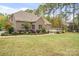 Well-maintained backyard featuring lush landscaping and a spacious wooden deck at 472 Barber Loop, Mooresville, NC 28117