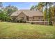 Large backyard featuring a wooden deck and lush landscaping; perfect for outdoor entertaining at 472 Barber Loop, Mooresville, NC 28117