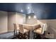 A bar with seating provides a great spot for entertaining in this home theater at 472 Barber Loop, Mooresville, NC 28117