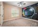 Bright bedroom with a window and carpet, featuring a unique hand painted mural accent wall at 472 Barber Loop, Mooresville, NC 28117