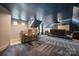 Home theater boasts a projector screen, comfortable seating, and a bar area at 472 Barber Loop, Mooresville, NC 28117