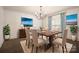 Formal dining room featuring elegant furniture, artwork, and natural light at 472 Barber Loop, Mooresville, NC 28117