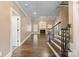 Open living room with hardwood floors, fireplace, and staircase at 472 Barber Loop, Mooresville, NC 28117