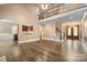 Spacious open-concept living room featuring hardwood floors and staircase at 472 Barber Loop, Mooresville, NC 28117