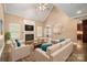 Inviting living room with fireplace, large windows, and comfortable seating at 472 Barber Loop, Mooresville, NC 28117