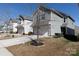 Street view of gray house with two-car garage, concrete driveway, and minimal landscaping at 6037 Halliwell St, Rock Hill, SC 29732