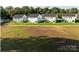 Aerial view highlights expansive lot, community landscaping, and ideal location at 620 Smith St # B, Mooresville, NC 28115