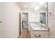 Bathroom with double vanity, gray cabinets, granite countertops, and chrome fixtures at 620 Smith St # B, Mooresville, NC 28115