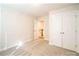 Hallway view showcases natural lighting, and a conveniently located closet at 620 Smith St # B, Mooresville, NC 28115