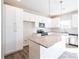 Bright kitchen features white cabinetry, granite countertops, stainless steel appliances and center island at 620 Smith St # B, Mooresville, NC 28115