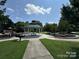 A gazebo in a park setting features playground and a picnic table under its shelter at 620 Smith St # B, Mooresville, NC 28115