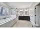 Bathroom features a double sink vanity, freestanding tub, and glass shower at 726 Amberly Xing, Fort Mill, SC 29708