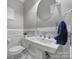 Bathroom with pedestal sink, modern fixtures, and decorative tile at 726 Amberly Xing, Fort Mill, SC 29708