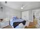 Cozy bedroom with hardwood floors, ceiling fan, and a closet in a neutral color palette at 726 Amberly Xing, Fort Mill, SC 29708