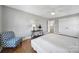 Bedroom with hardwood floors, a ceiling fan, and a blue accent chair at 726 Amberly Xing, Fort Mill, SC 29708