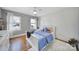 Bright bedroom with hardwood floors, large windows, and a ceiling fan at 726 Amberly Xing, Fort Mill, SC 29708