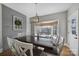 Inviting dining room with a modern light fixture and a view of the outdoors at 726 Amberly Xing, Fort Mill, SC 29708