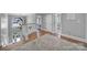 Bright entryway with chandelier lighting and a staircase leading to the lower level, showcasing modern design at 726 Amberly Xing, Fort Mill, SC 29708