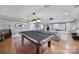 Large game room with pool table and media room in background at 726 Amberly Xing, Fort Mill, SC 29708