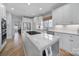 Bright kitchen features a center island, stainless steel appliances, and white cabinets at 726 Amberly Xing, Fort Mill, SC 29708