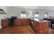 Modern kitchenette features stainless steel appliances, sleek countertops, and warm wood cabinetry at 726 Amberly Xing, Fort Mill, SC 29708