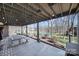 Relaxing outdoor patio area with a wooden table, bench, and view of the lake at 726 Amberly Xing, Fort Mill, SC 29708