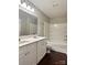 This bathroom has a double sink vanity, a large mirror with lights, and a shower/tub at 7306 Fox Point Dr, Charlotte, NC 28269