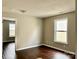Bedroom with wood-look floors, a window, and neutral walls at 7306 Fox Point Dr, Charlotte, NC 28269