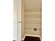 Storage area featuring white wire shelving and a white door with a brushed metal handle at 7306 Fox Point Dr, Charlotte, NC 28269