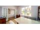 Bright home office with french doors, neutral colors, and a large window at 7724 Woolsey Dr, Gastonia, NC 28056