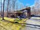 Exterior showing a deck, patio, and landscaped backyard with a car in the driveway at 8015 Sullivan Dr # 3 And 2, Charlotte, NC 28215
