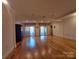 This is a finished basement with hardwood floors, sliding glass doors, and recessed lighting at 8015 Sullivan Dr # 3 And 2, Charlotte, NC 28215