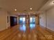 This is a finished basement with hardwood floors, sliding glass doors, and recessed lighting at 8015 Sullivan Dr # 3 And 2, Charlotte, NC 28215