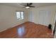 This is a bright and cheerful bedroom with hardwood floors and a double closet at 8015 Sullivan Dr # 3 And 2, Charlotte, NC 28215