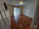 A well-lit bedroom featuring hardwood floors and natural light at 8015 Sullivan Dr # 3 And 2, Charlotte, NC 28215