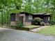 Charming single-story home with a brick chimney, nestled among lush greenery with a beautiful landscaped yard at 8015 Sullivan Dr # 3 And 2, Charlotte, NC 28215