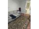 A comfortable living room featuring a couch, an area rug and an open doorway at 8015 Sullivan Dr # 3 And 2, Charlotte, NC 28215