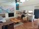 Open-concept living area with a fireplace and kitchen view at 8015 Sullivan Dr # 3 And 2, Charlotte, NC 28215